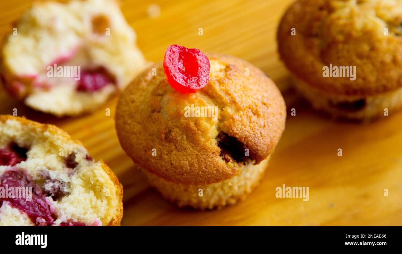 Candied cherry muffins made in a German patisserie Stock Photo Alamy