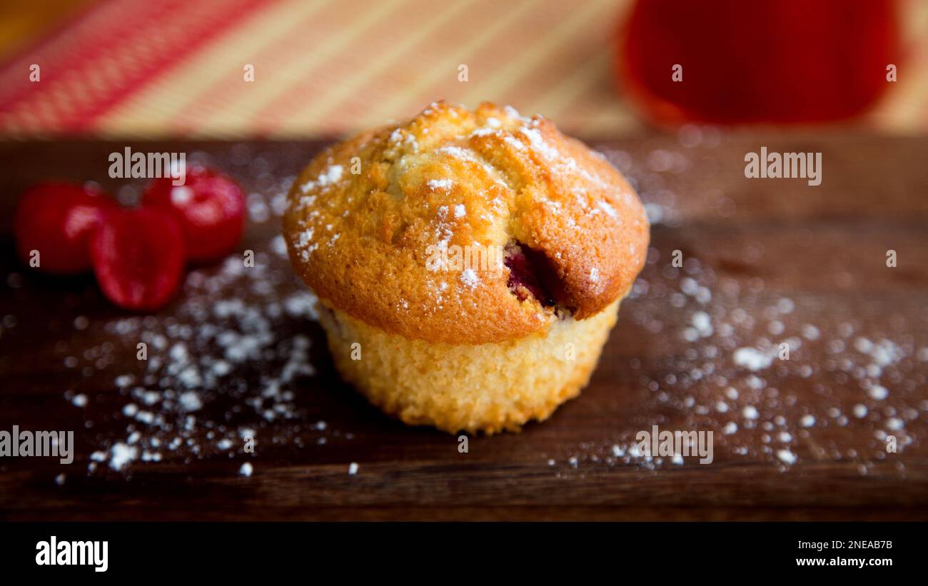 Candied cherry muffins made in a German patisserie Stock Photo Alamy