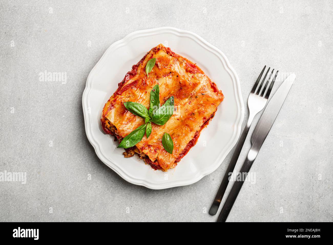 Cannelloni with meat, tomato sauce and cheese Stock Photo Alamy