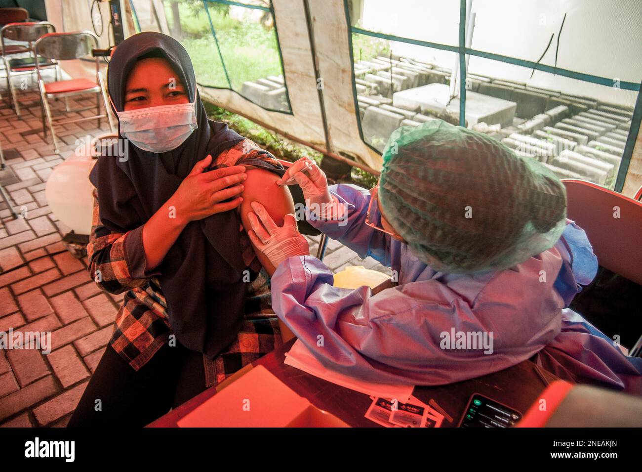 Yogyakarta, Indonesia. 16th Feb, 2023. A woman receives a second booster dose of COVID-19 vaccine in Yogyakarta, Indonesia, Feb. 16, 2023. Credit: Agung Supriyanto/Xinhua/Alamy Live News Stock Photo