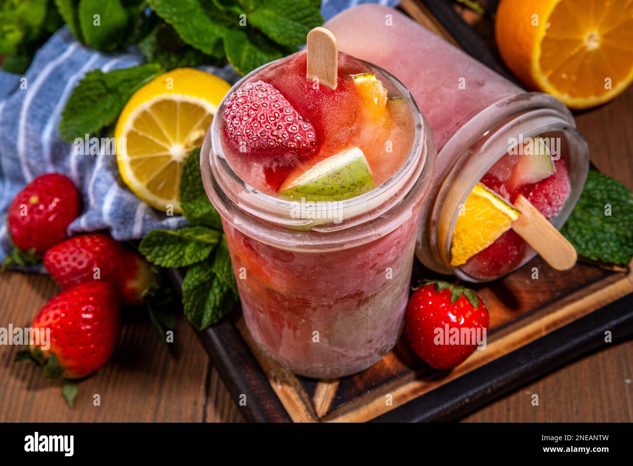 Frozen mocktail, popsicle punch with fruit and berry. Iced summer sangria with strawberry