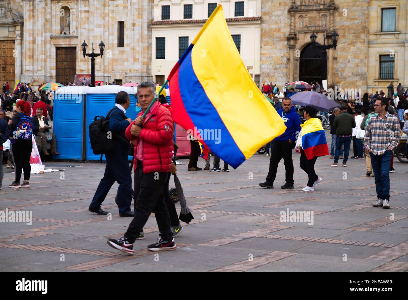 A demonstrator carries a Colombian flag during a demonstration to support Colombian government reforms in Bogota, Colombia on February 14, 2023. Stock Photo