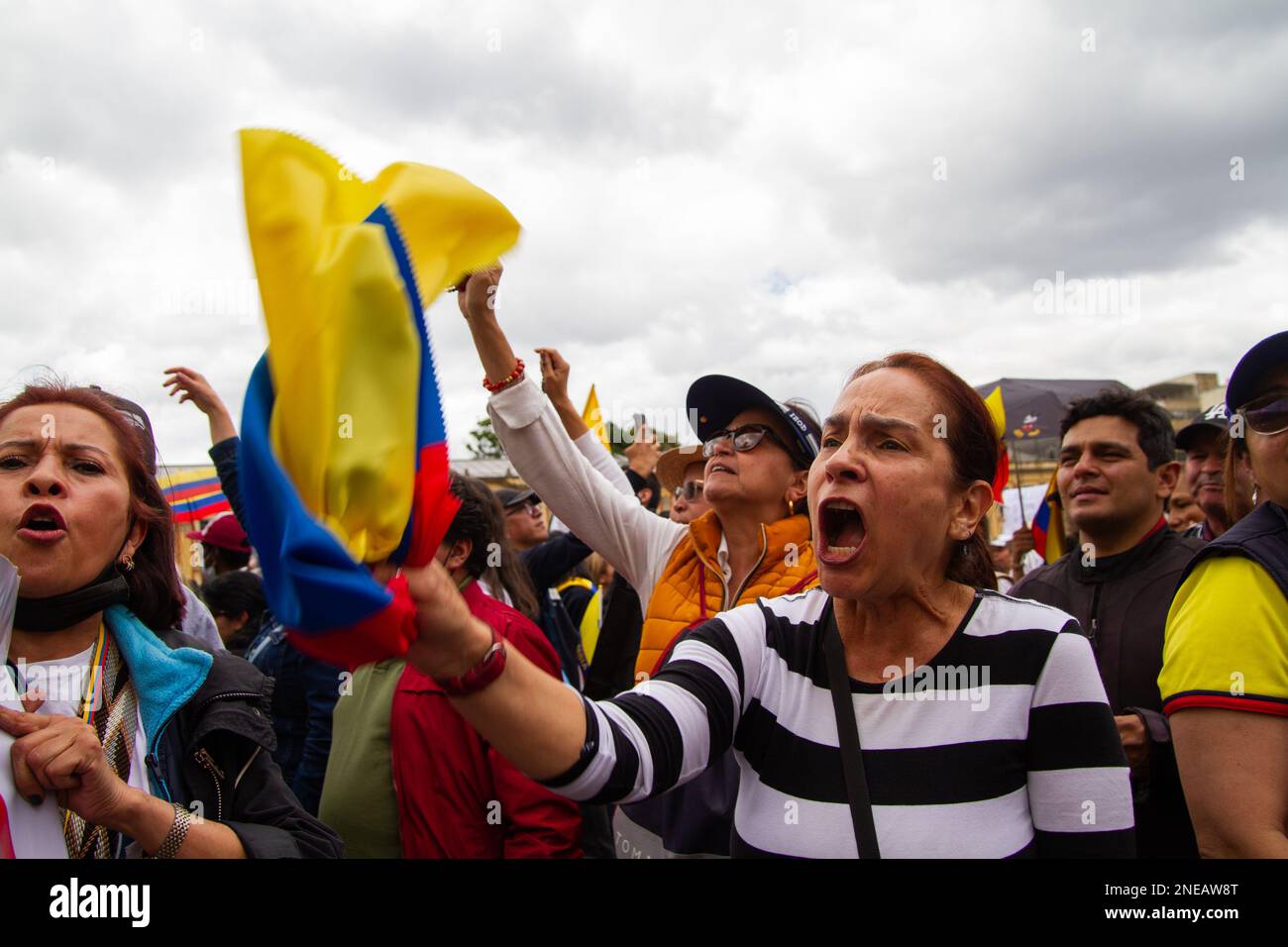 Demonstrators wave and carry Colombian flags during the demonstrations against the reform proposals of Colombian president Gustavo Petro, in Bogota, C Stock Photo
