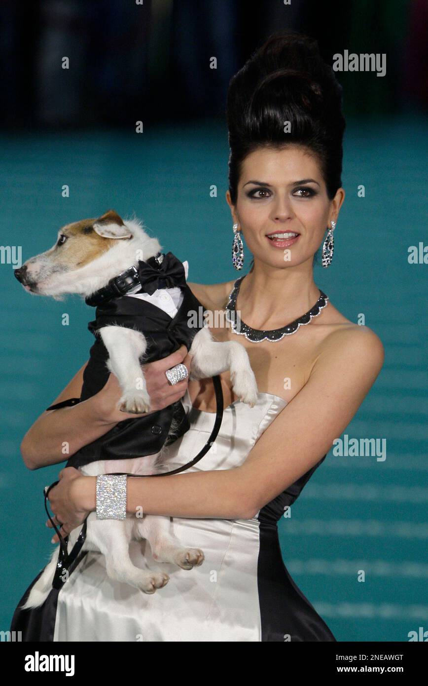 Spanish model Maria Reyes and her dog pose on arrival at the Goya 2010 ...