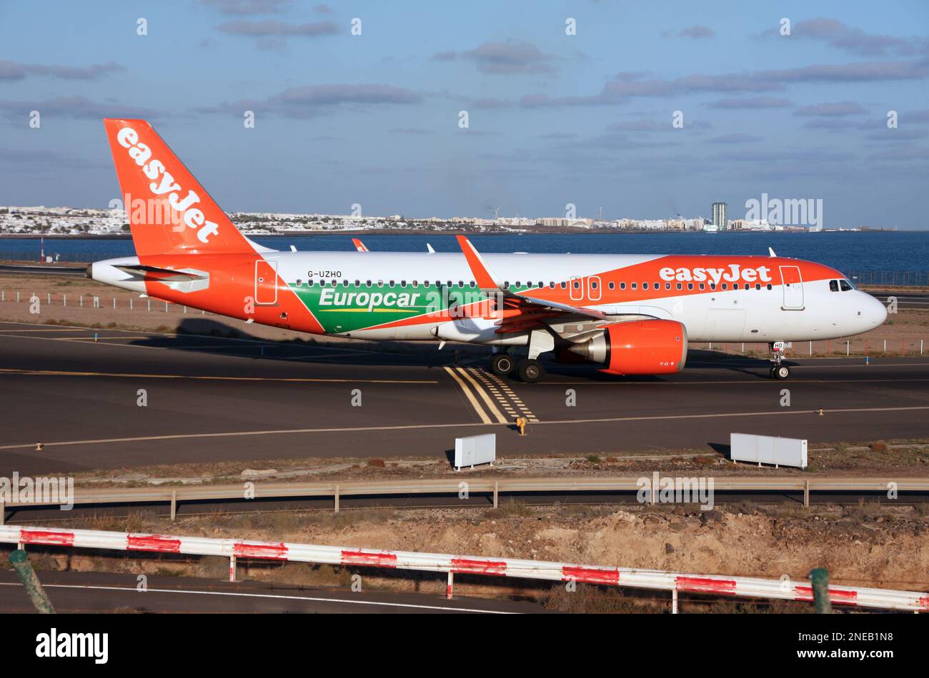 An easyjet a320neo advertising Europcar departs Lanzarote Arrecife