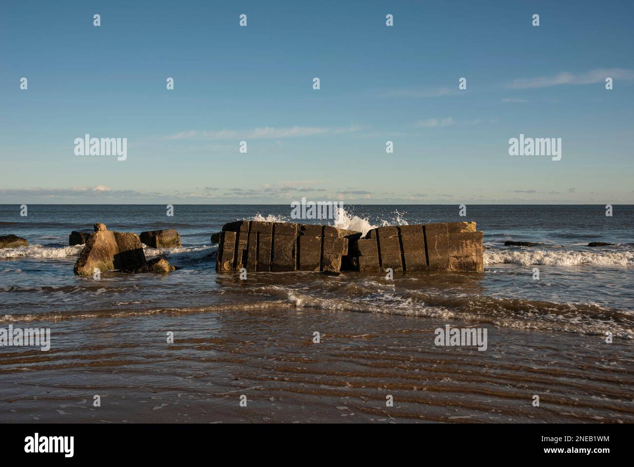 Remnants of old World War 2 concrete pill boxes on Fraisthorpe Beach near Bridlington, East Yorkshire, UK Stock Photo