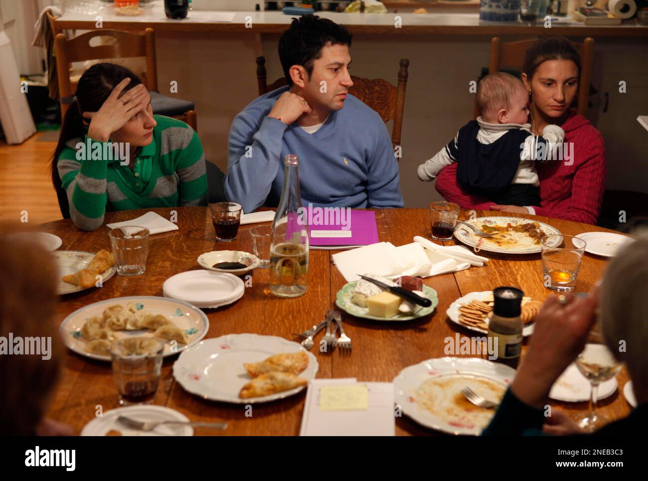 TO GO WITH SLUG INDOCUMENTADOS TRAICIONADOS** In this Jan. 19, 2010 photo,  Emilio Maya, center, is surrounded by his wife, Kseniya Maya, left, and his  sister Analia Maya, holding her son Santiago,