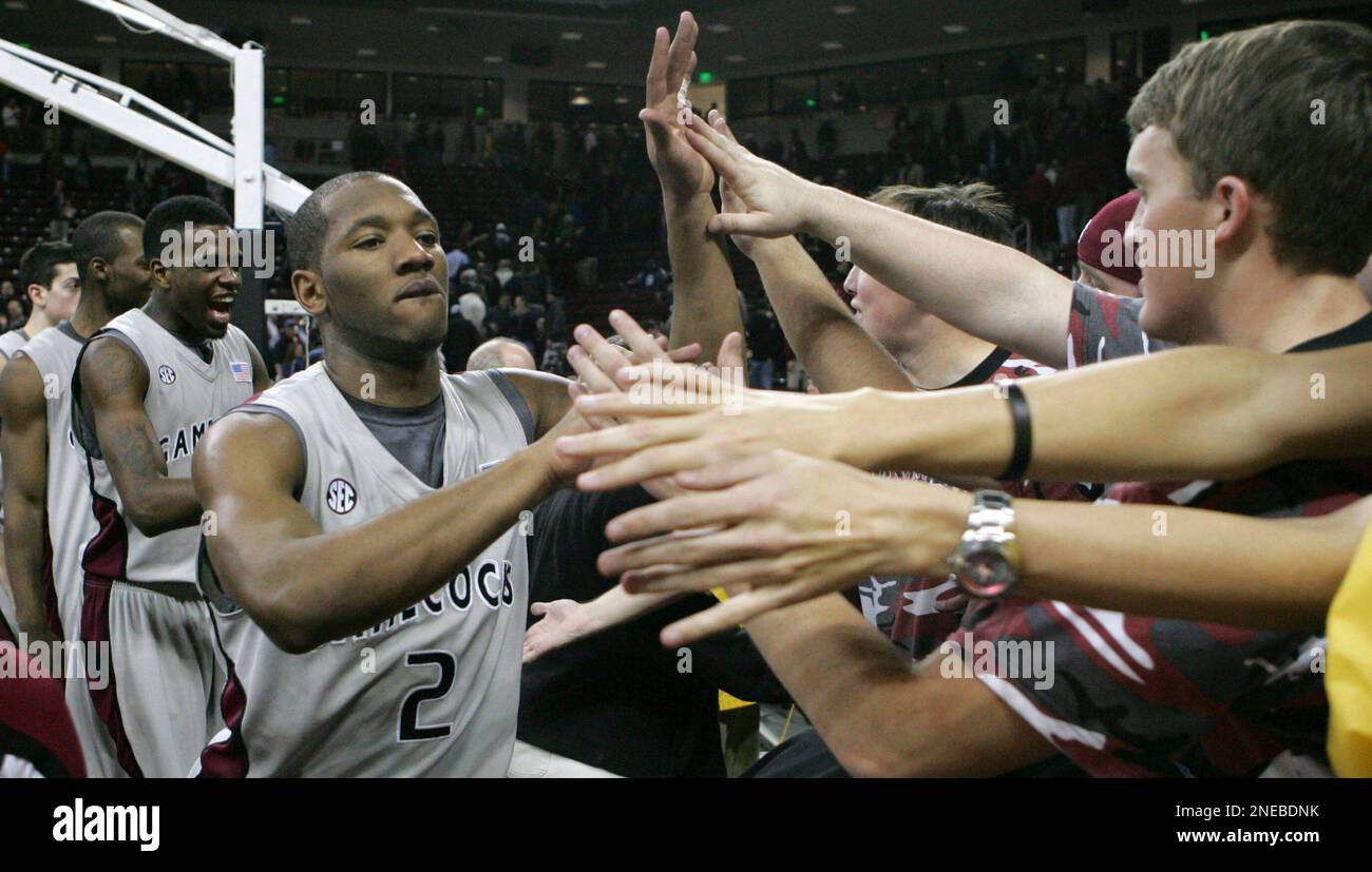 South Carolina's Devan Downey celebrates with fans after South Carolina