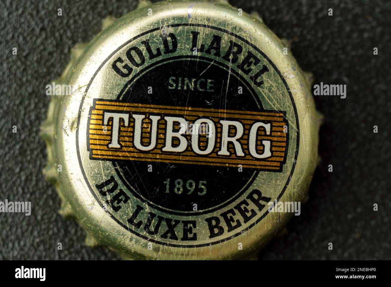 Tyumen, Russia-February 15, 2023: Tuborg beer, produced by a Danish brewing company. Old beer lid, macro Stock Photo