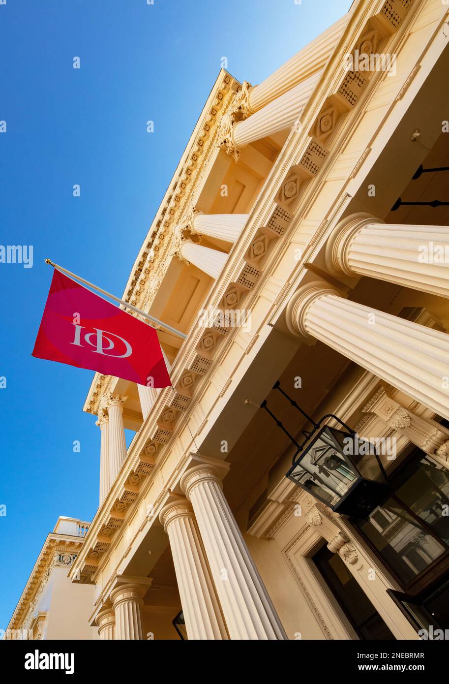 Frontage and flag of The Institute of Directors (IoD), 116 Pall Mall, London; designed by John Nash in 1828, and formerly the United Service Club. Stock Photo