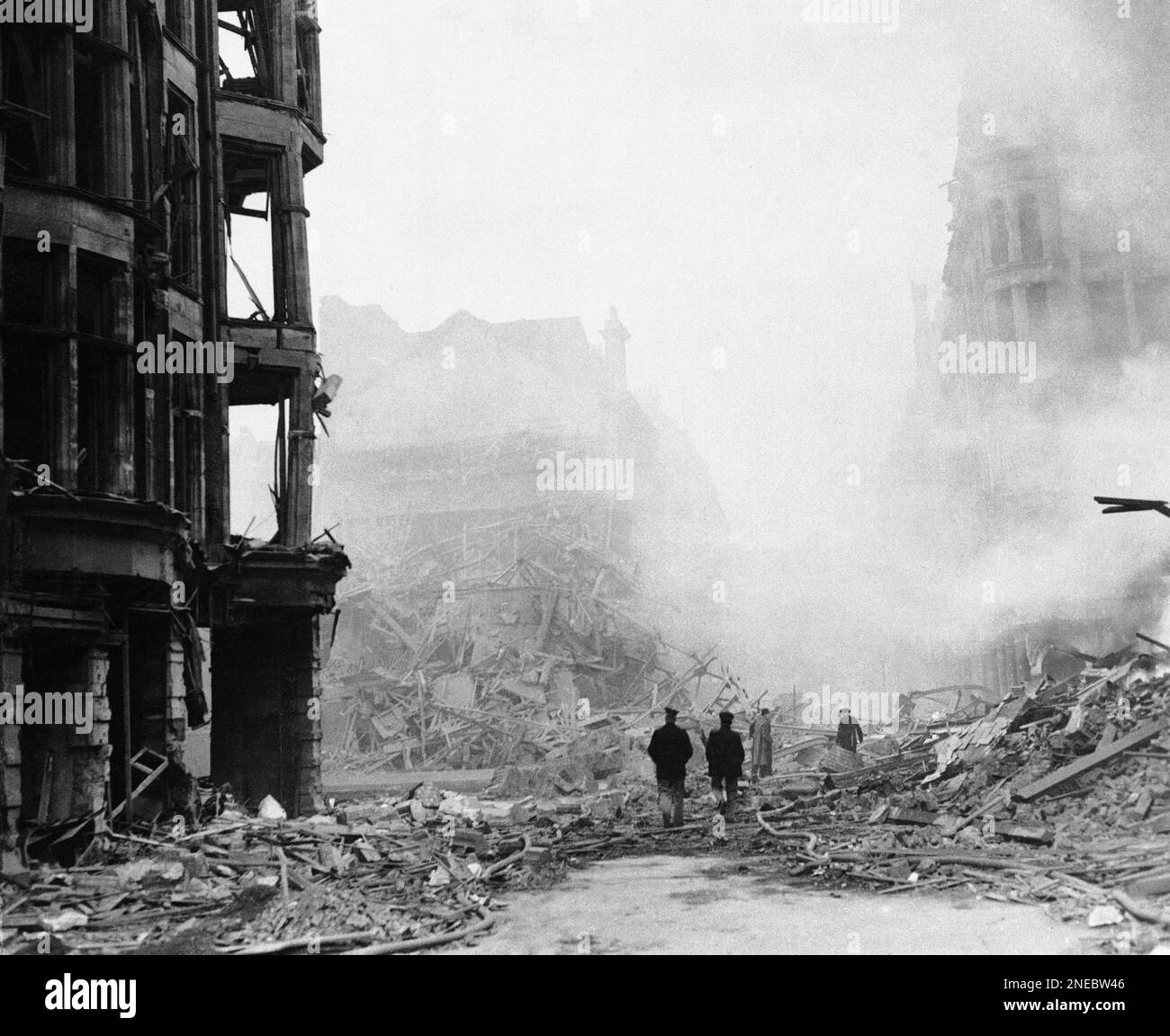 Smoke hangs over the rubble and damaged buildings of King Street in ...