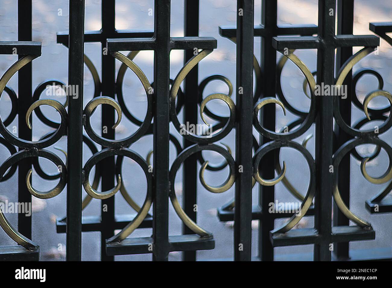 Detail of painted metal fence. Wrought iron metal gate with geometric pattern Stock Photo