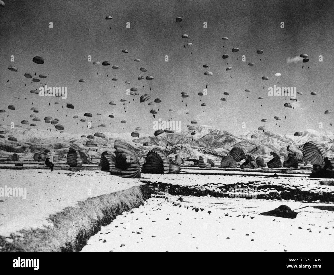 Men of the 187th RCT make a practice jump in Korea in March 1951 as ...