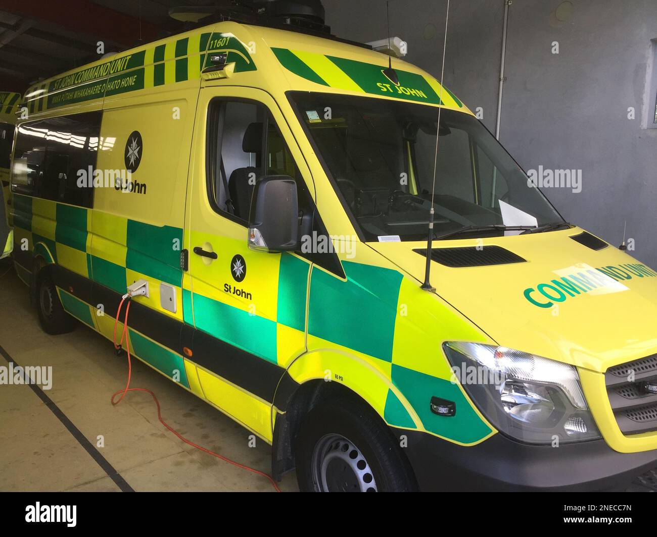 A yellow and green St. John Ambulance vehicle Stock Photo Alamy