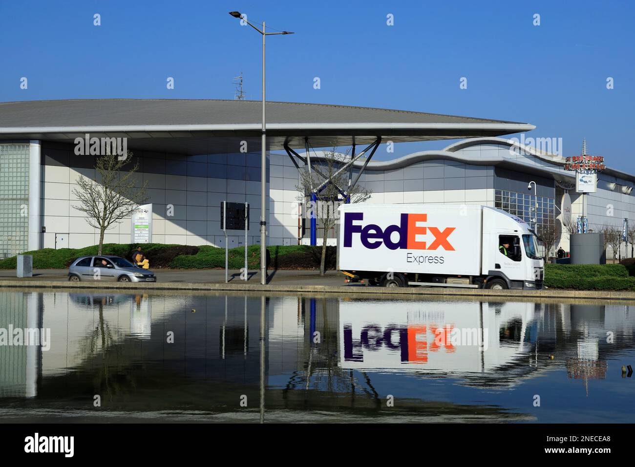 FedEx delivery lorry and Red Dragon Centre, Cardiff Bay, Cardiff, Wales. Stock Photo