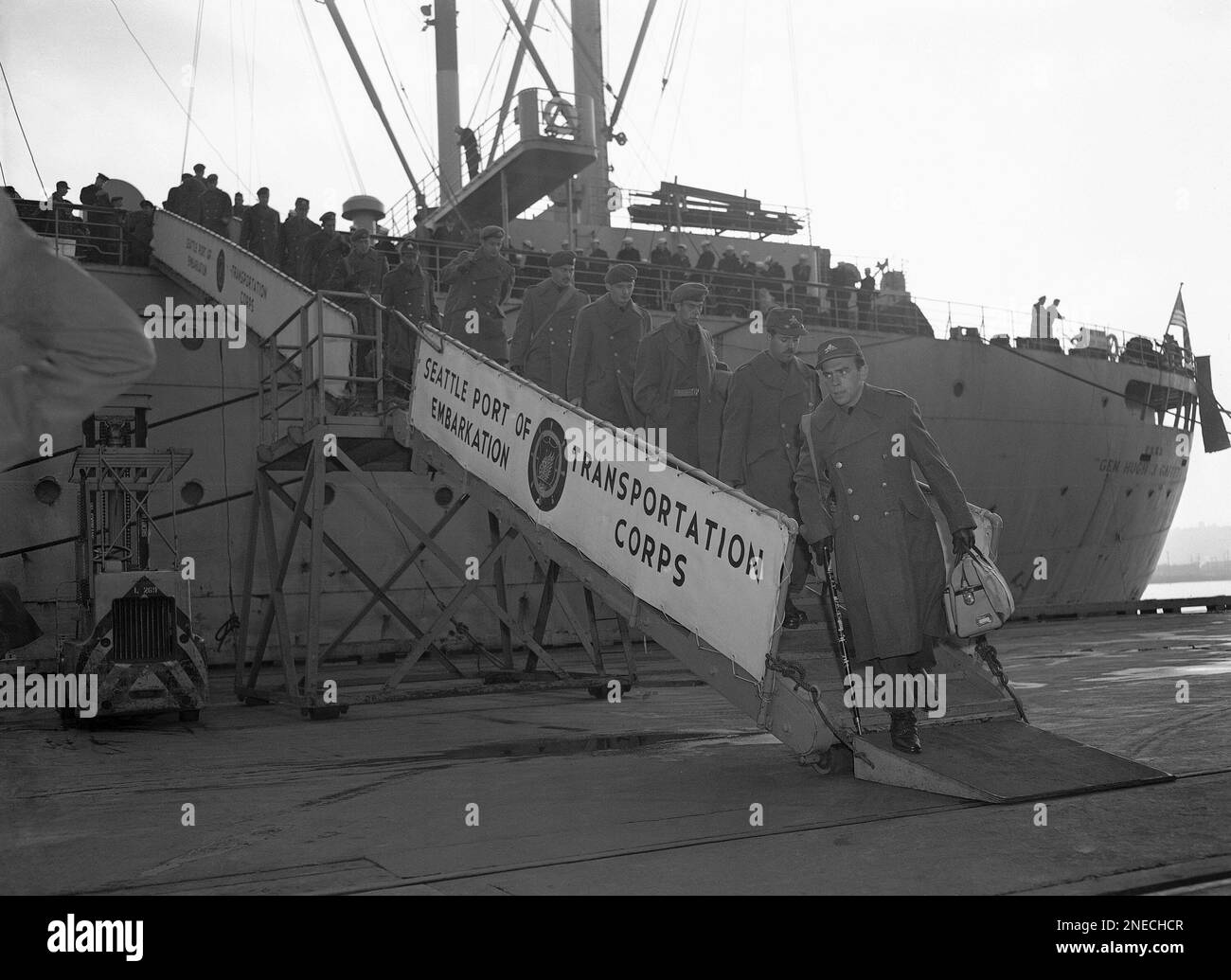 Troops of famed Canadian Princess Pats regiment from Korea stomp down gangplank on Dec. 16, 1952 in Seattle after arrival on a troopship from Far East. They were among 1,551 passengers, including U.S. military personnel and dependents. (AP Photo/Ed Johnson) Stock Photo