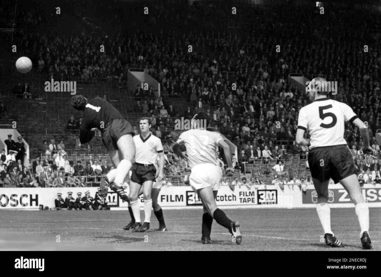 West German goalkeeper Hans Tilkowski, left, makes a save from 