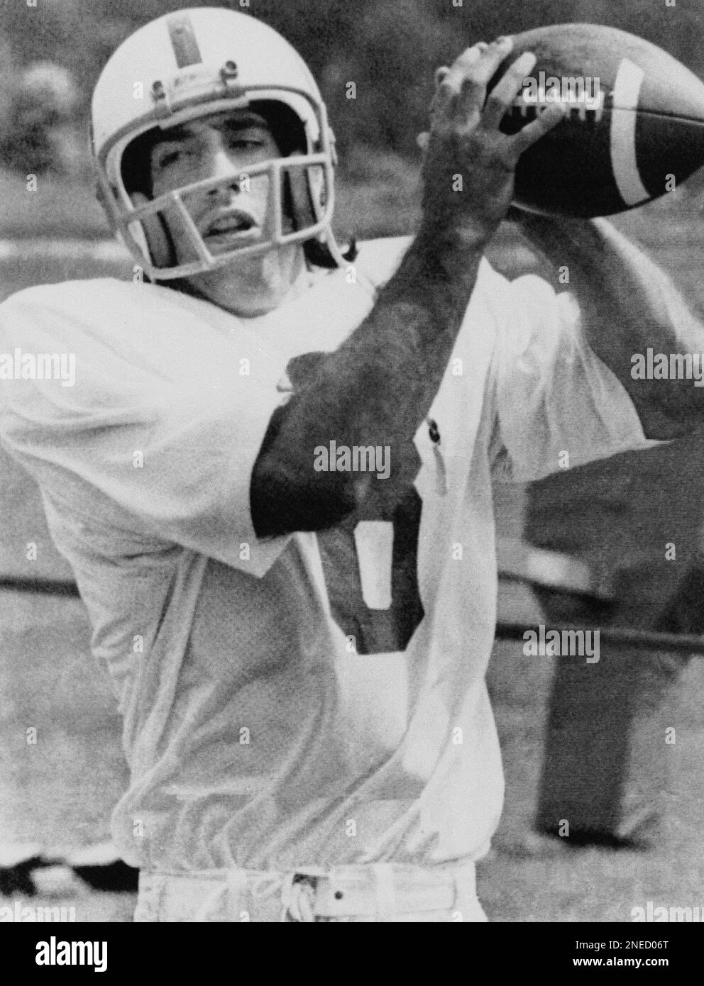 Baltimore Colt wide-receiver Tim Berra, the son of New York Mets Manager Yogi  Berra, is shown doing some catching and throwing himself during practice  with the team in Baltimore on August 6