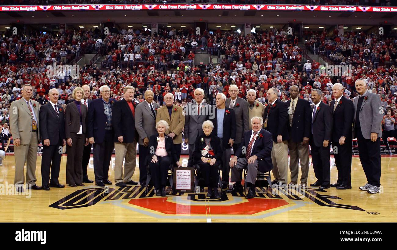 Members of Ohio State s 1960 national championship team stand at center court during a halftime ceremony honoring coach Fred Taylor and the team Sunday Jan. 31 2010 in Columbus Ohio. Some of