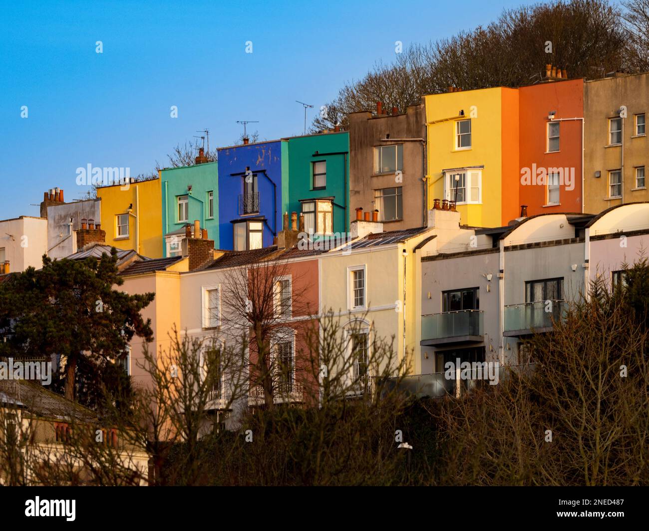 Rear elevation of colourful terraced houses in the Cliftonwood area of Bristol, overlooking the river Avon and Bristol Marina. UK Stock Photo