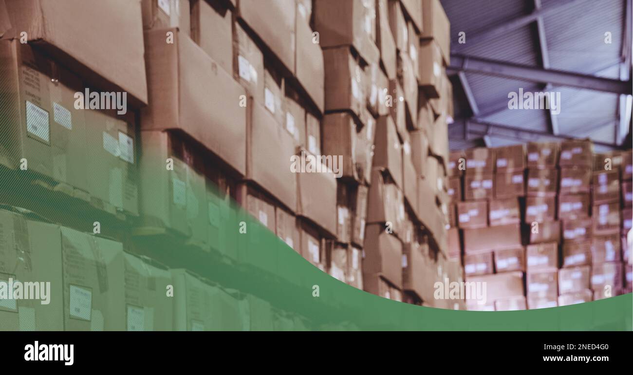 Green technology background over stack of cardboard boxes in the ...