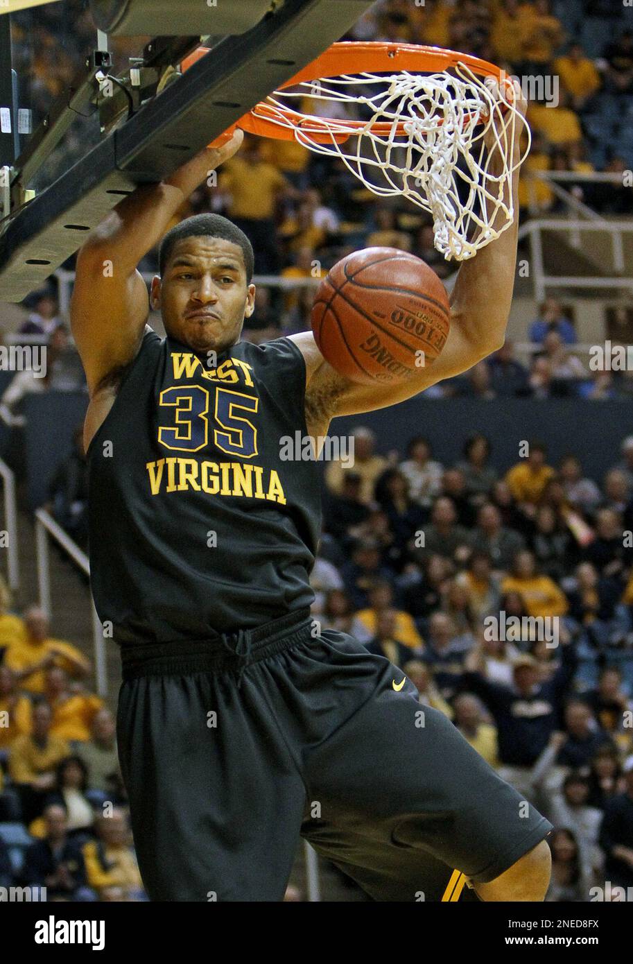 West Virginia's Wellington Smith (35) dunks against Louisville during