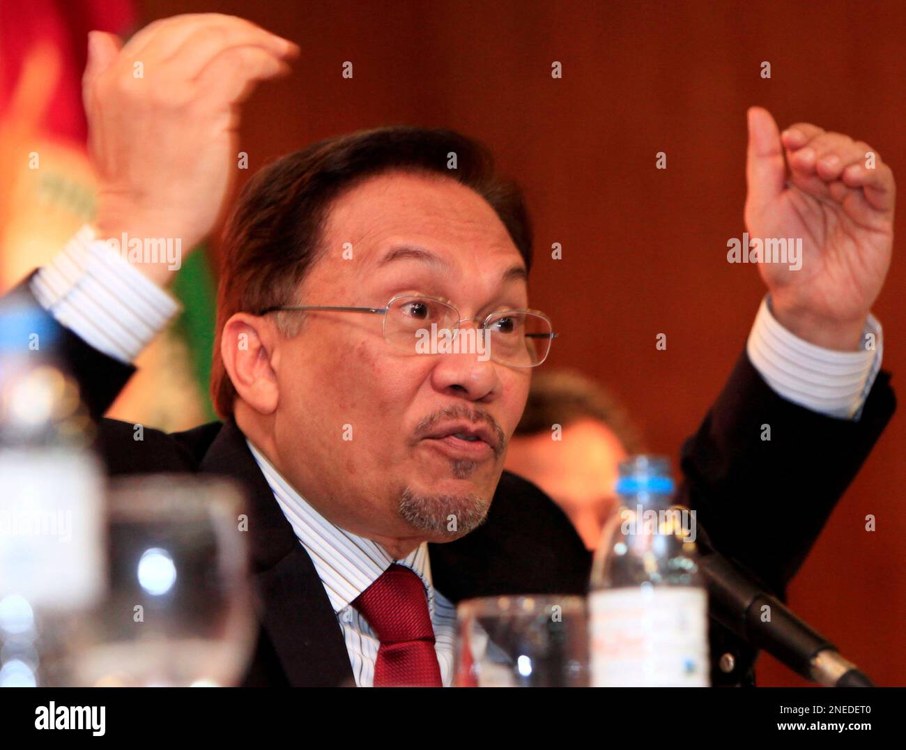 Malaysian opposition leader Anwar Ibrahim gestures during a forum with ...
