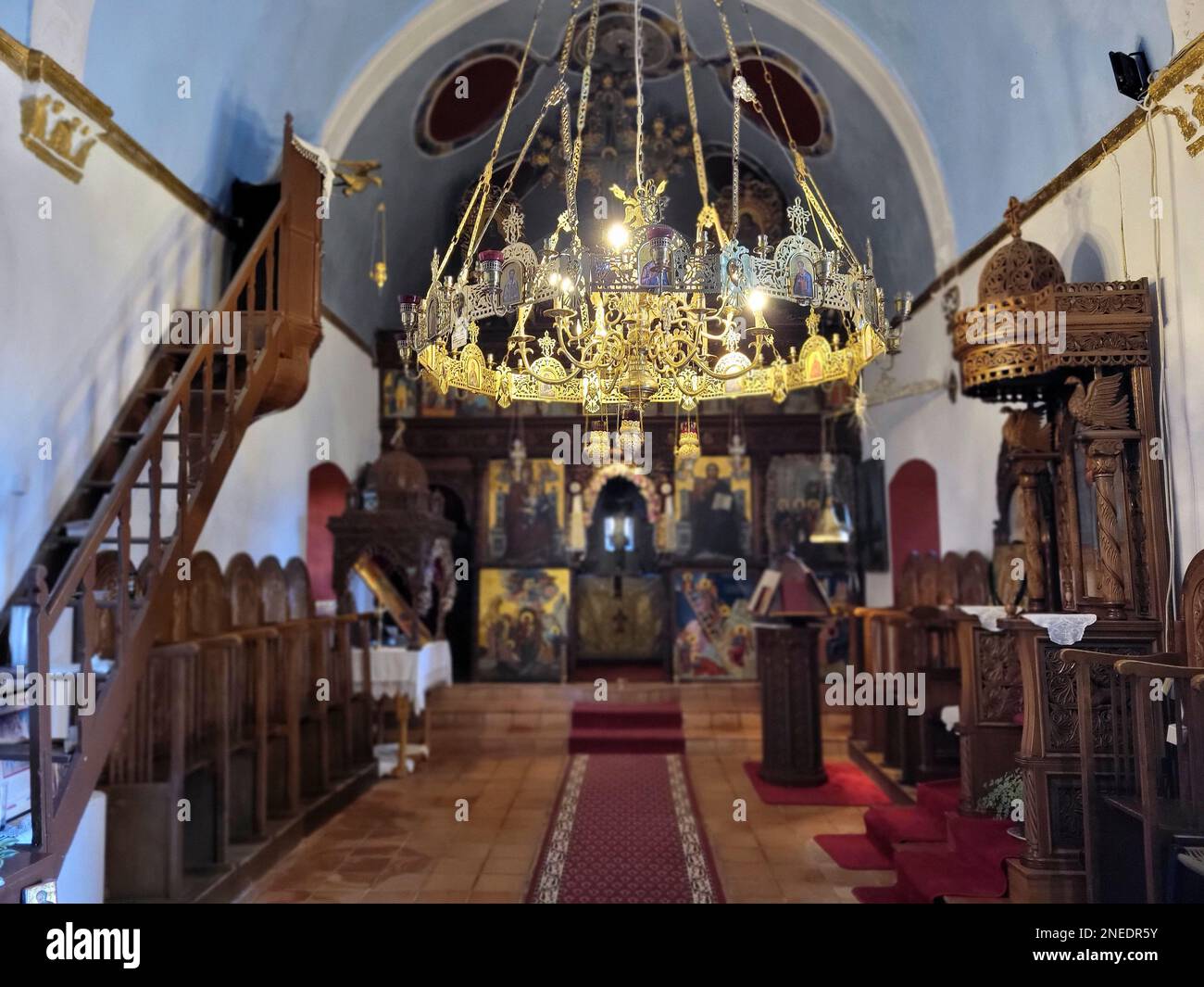 Greece, inside orthodox church on Lasithi Plateau with artistically worked chandelier Stock Photo