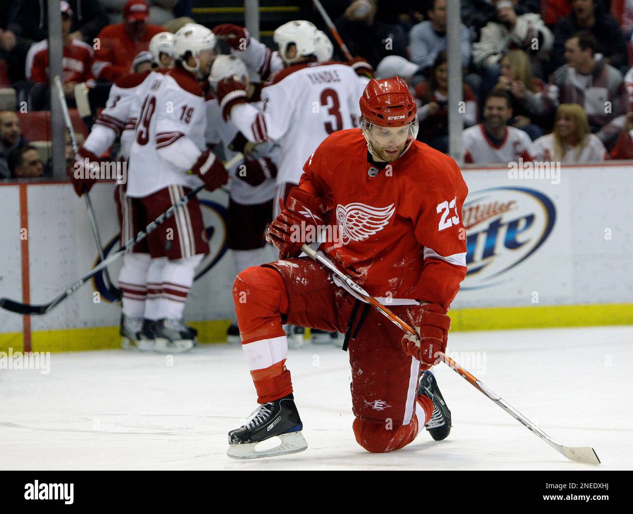 Detroit Red Wings defensman Brad Stuart kneels while Phoenix Coyotes