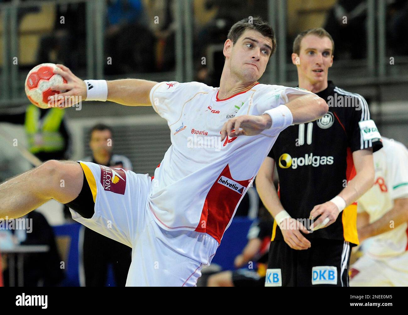 Holger Glandorf of Germany, right, looks on as Julen Aguinagalde of Spain scores during the men's handball European Championship Group M2 main round match in Innsbruck, Austria, on Tuesday, Jan. 26, 2010. (AP Photo/Kerstin Joensson) Stock Photo