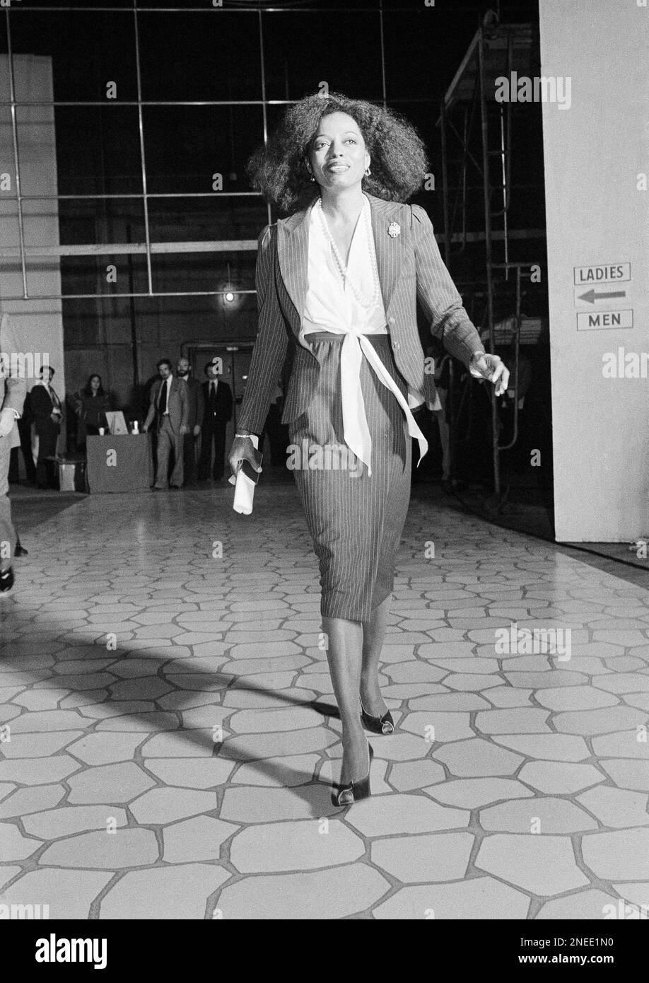 Following the yellow brick road entertainer Diana Ross walks the yellow