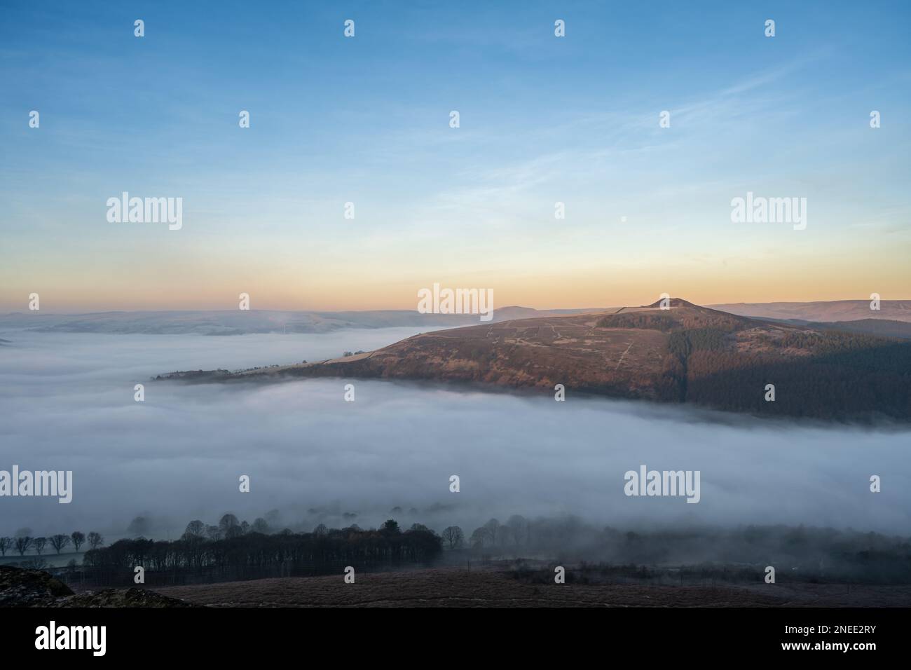 Bamford Edge. Ladybower, and Hope Valley winter sunrise temperature inversion in the Peak District National Park, England, UK. Stock Photo