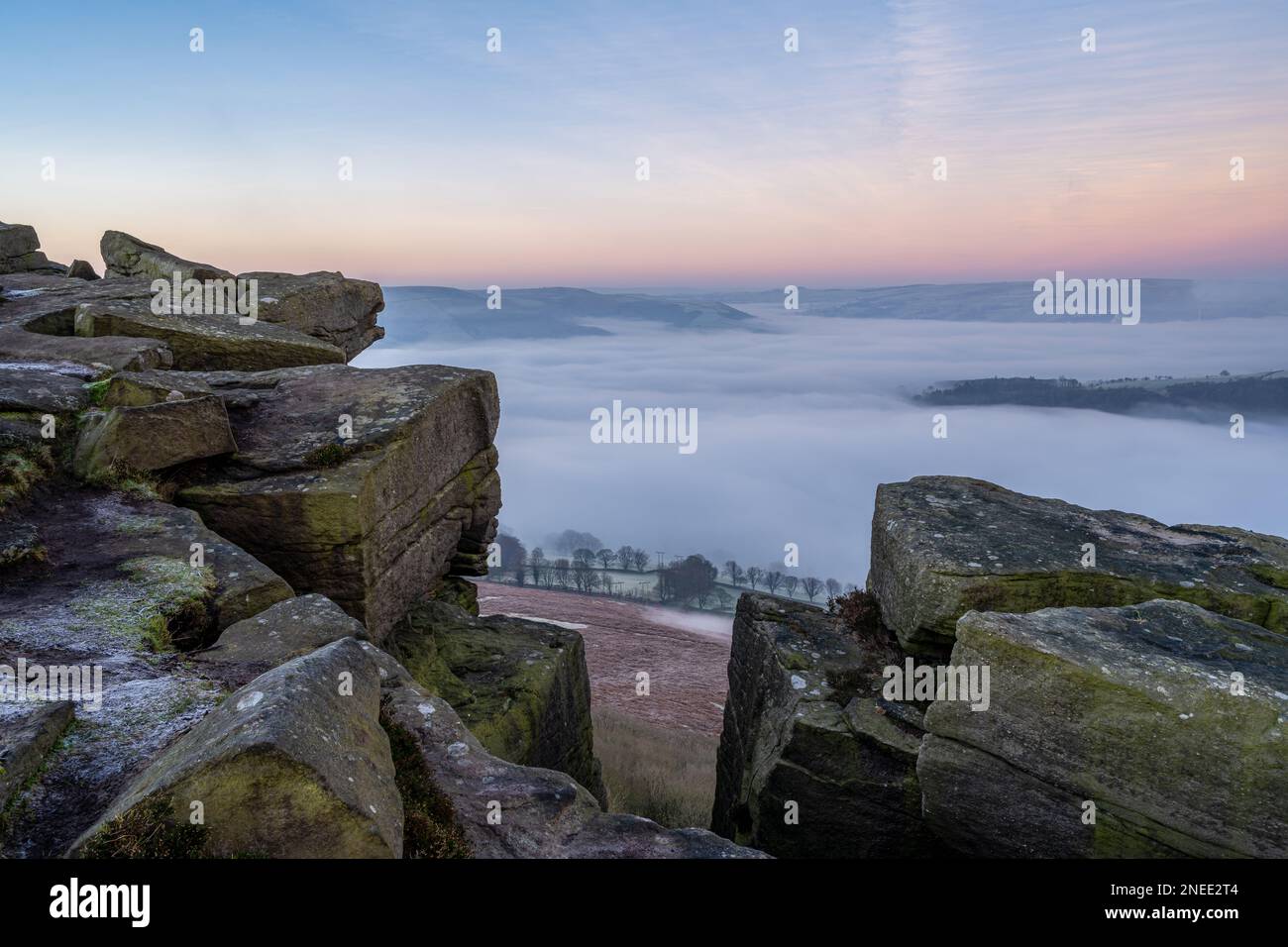 Bamford Edge. Ladybower, and Hope Valley winter sunrise temperature inversion in the Peak District National Park, England, UK. Stock Photo