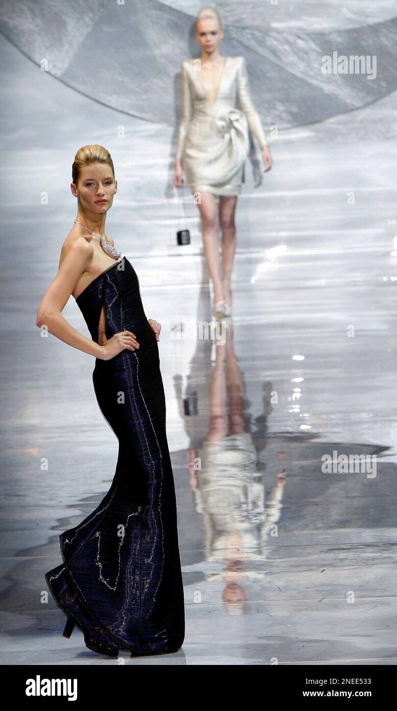 Models wear creations by Italian fashion designer Giorgio Armani during ...