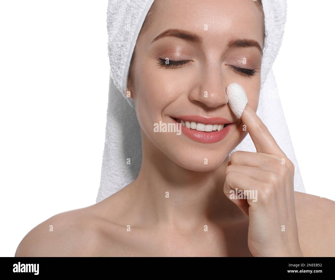 Woman using silkworm cocoon in skin care routine on white background ...