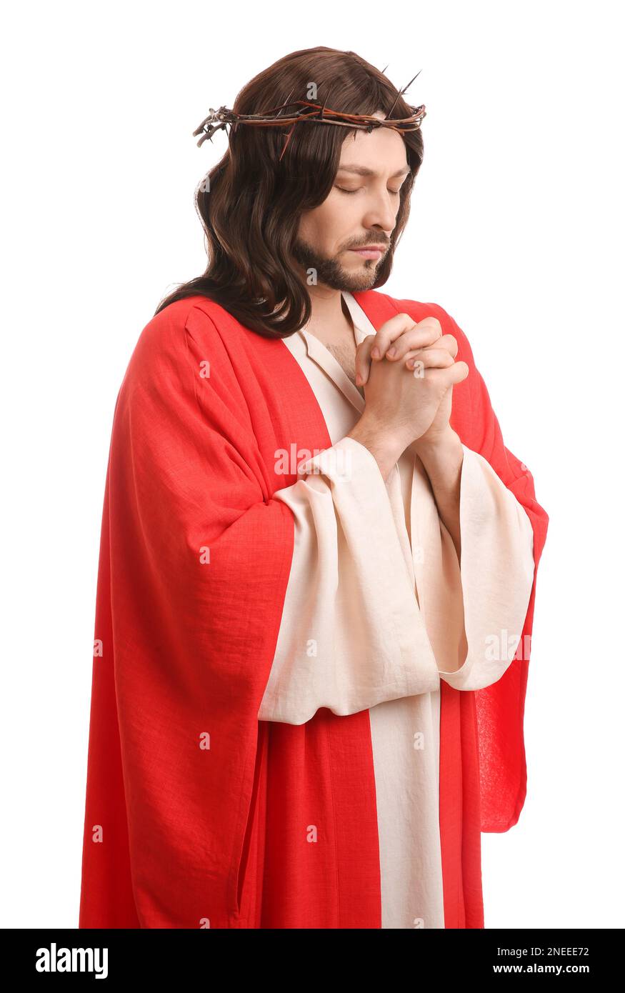 Jesus Christ with crown of thorns praying on white background Stock