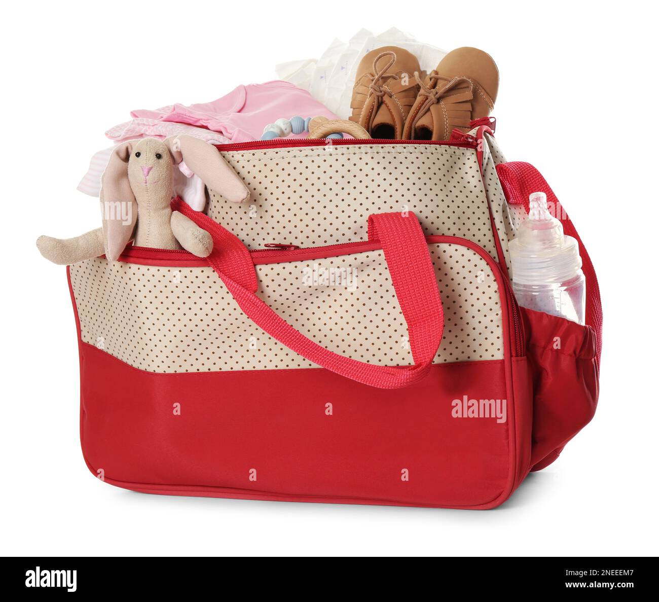 Maternity bag with child's clothes and accessories on white background