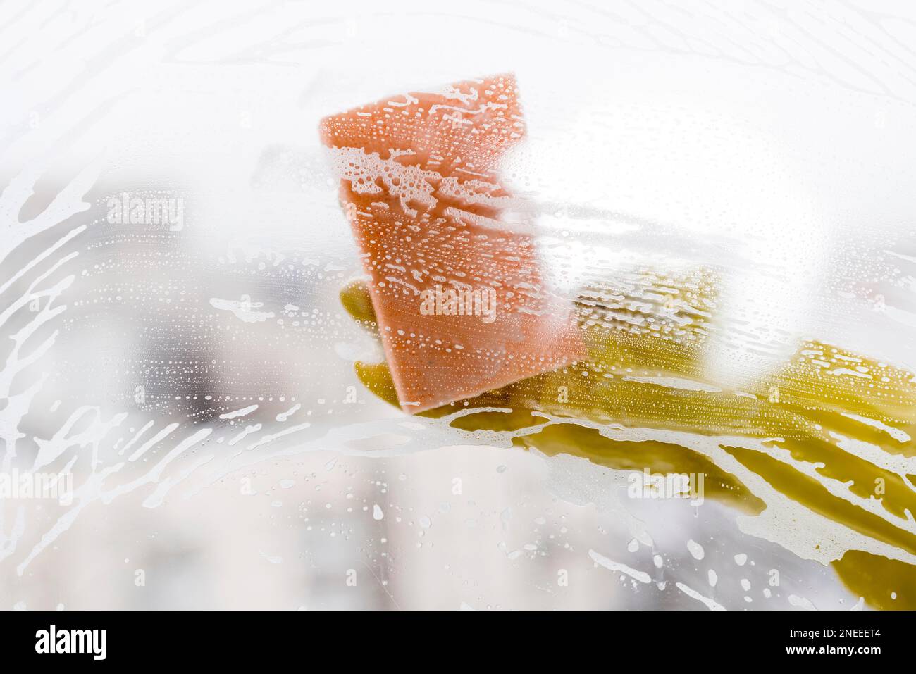 woman cleaning window with sponge. High resolution photo Stock Photo