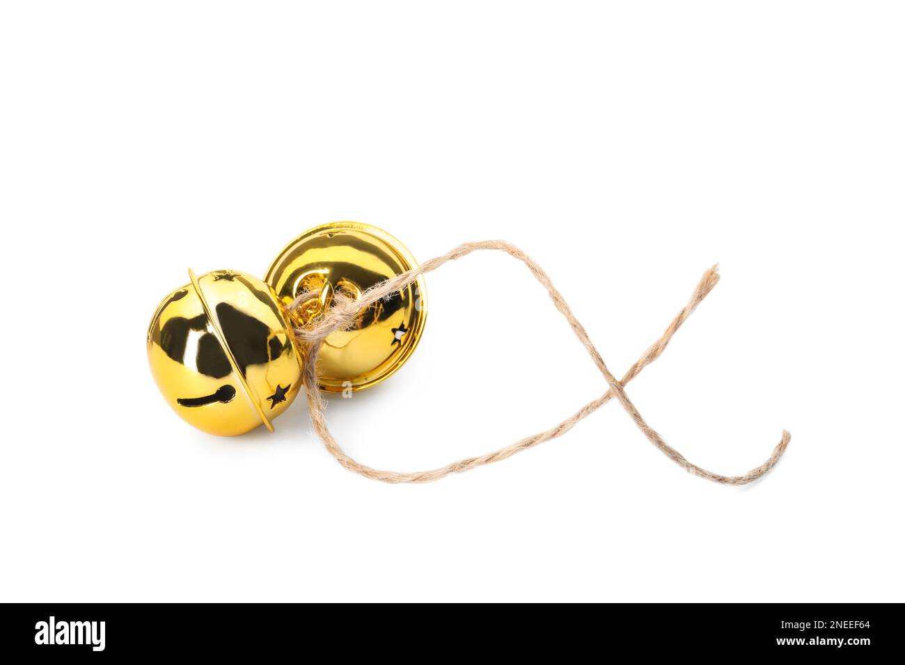 Shiny golden sleigh bells on white background Stock Photo - Alamy