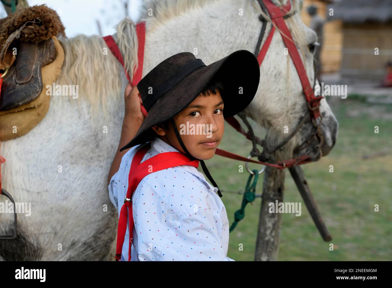 Young Gaucho with his horse at Puesto Mingo, portrait, Esteros del Ibera, at Concepcion del Yaguarete Cora, Corrientes Province, Argentina Stock Photo