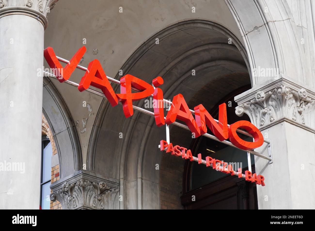 Hannover, Germany - March 2, 2020: Vapiano logo sign at local branch of german franchise restaurant chain serving italian food like pizza and pasta Stock Photo