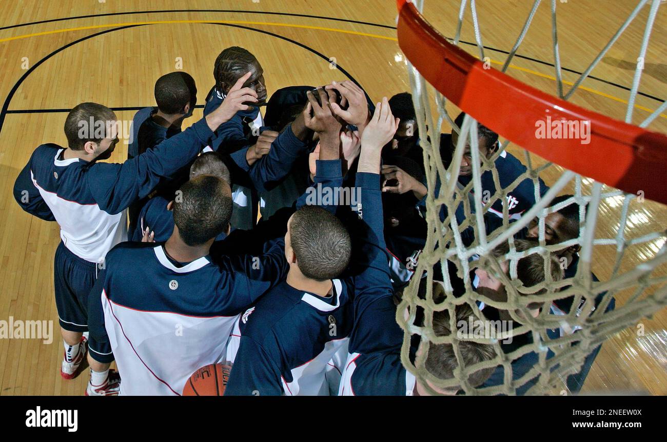 The Connecticut basketball team huddles before an NCAA basketball game