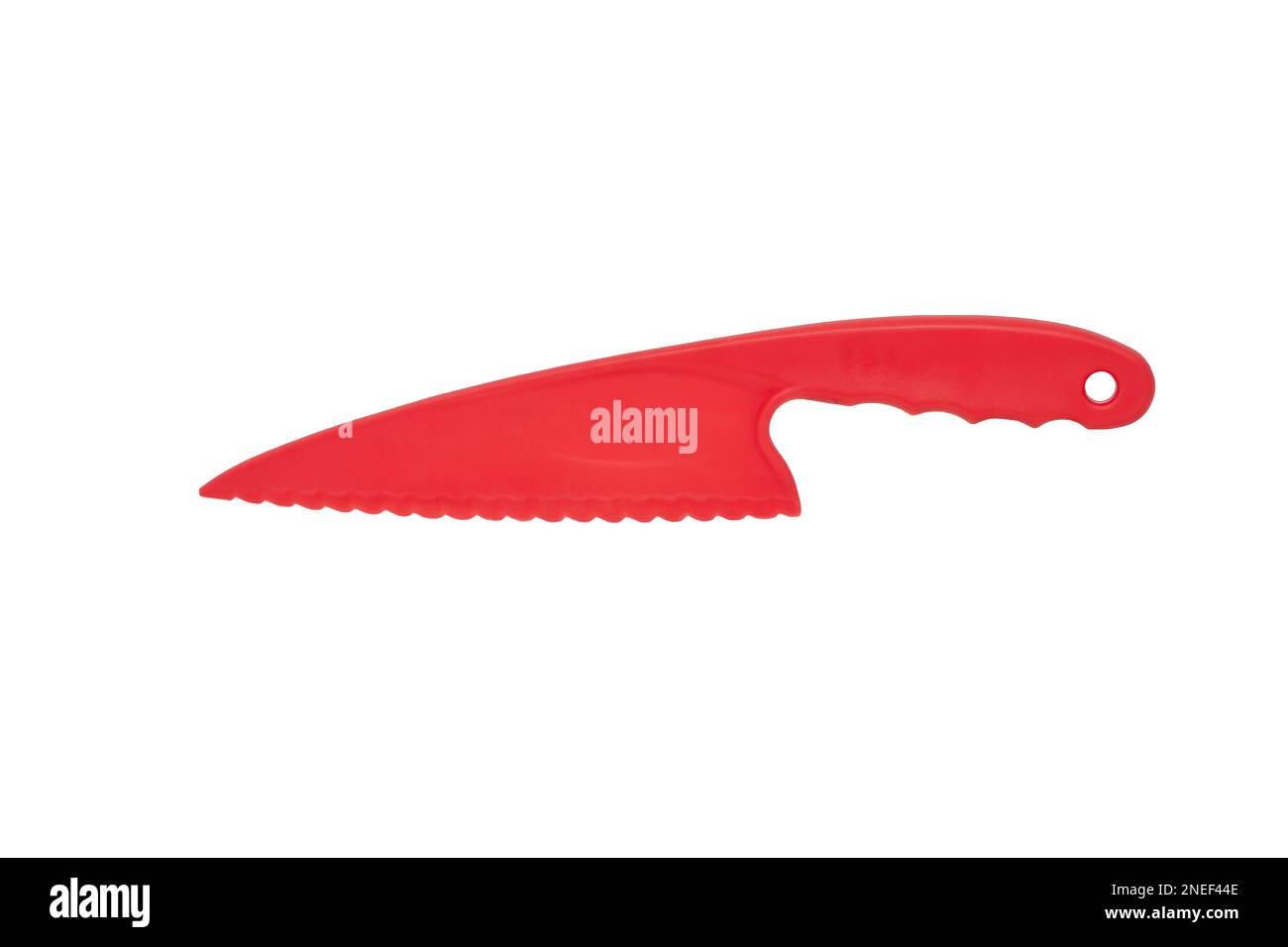 Image of a plastic knife of red color for cutting a cake on a white background Stock Photo