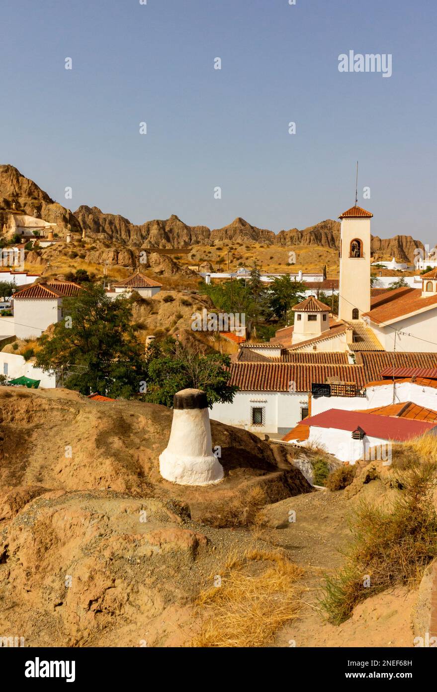 Chimneys of underground cave houses in the Barrio de Cuevas area of Guadix a town in Andalucia in southern Spain. Stock Photo