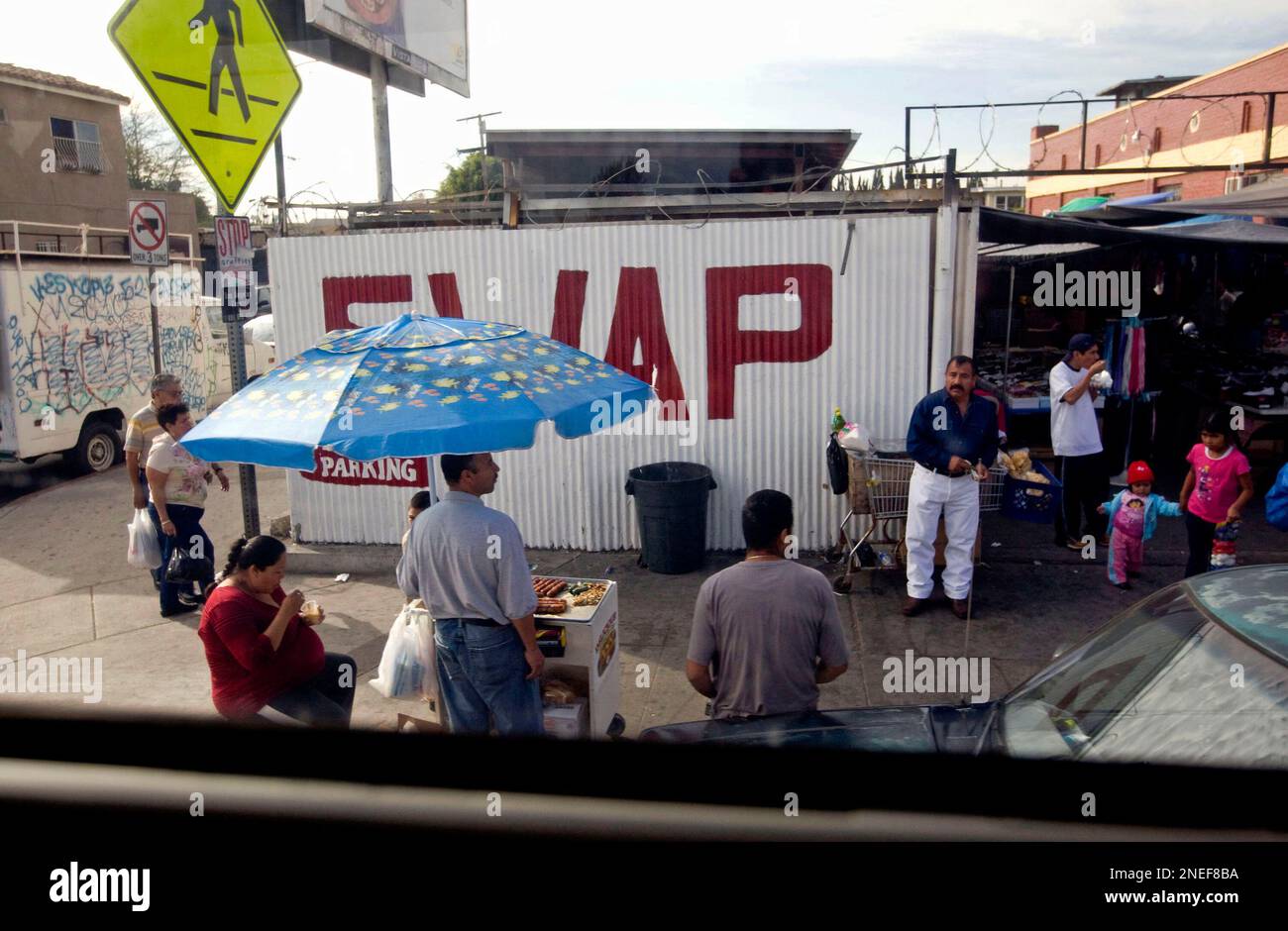 A view of a street in South Central Los Angeles during the \, image size:1300x940
