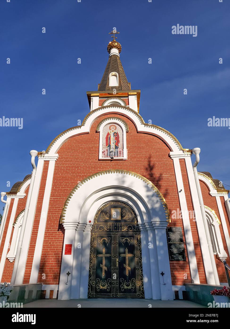 Gospel of Jesus Christ. The religious church is a chapel for praying to God.Golden domes with a crucifix at the top.A holy place for Orthodox Christia Stock Photo
