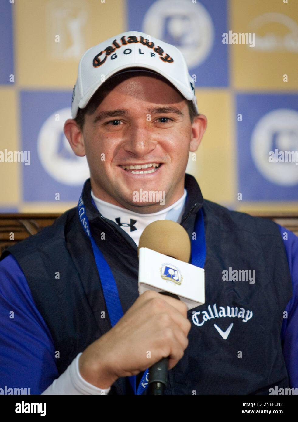 Sam Saunders, the grandson of Arnold Palmer, speaks to reporters during