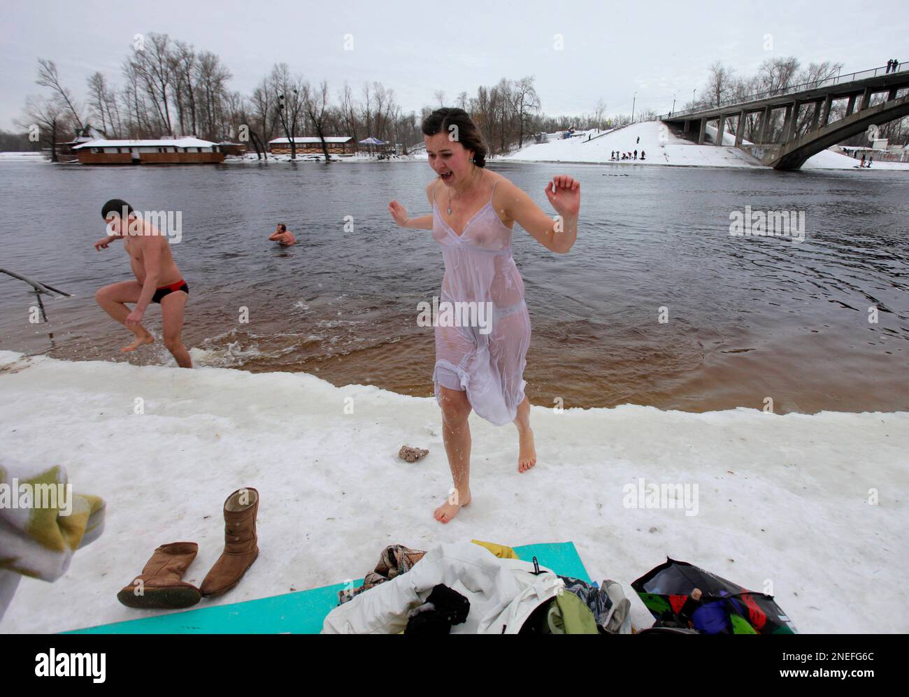 ** EDS NOTE: NUDITY ** A young Ukrainian woman walks out of the ice