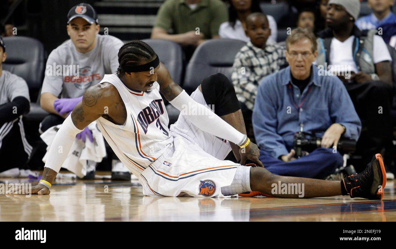 Charlotte Bobcats' Gerald Wallace (3) holds his ankle after being injured  in the second half of the Bobcats' 105-103 win over the Sacramento Kings in  an NBA basketball game in Charlotte, N.C.,, image size:1300x820