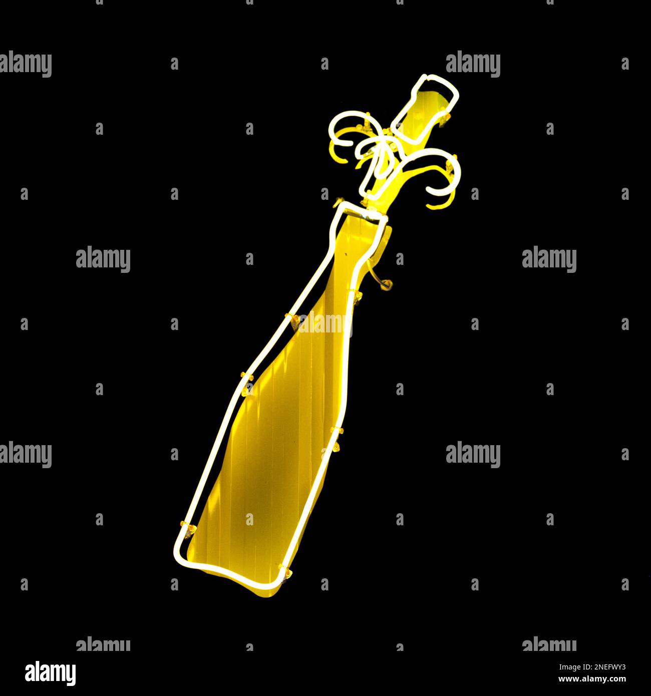 Close-up on a hello neon light shaped into bottle of Champagne. Stock Photo